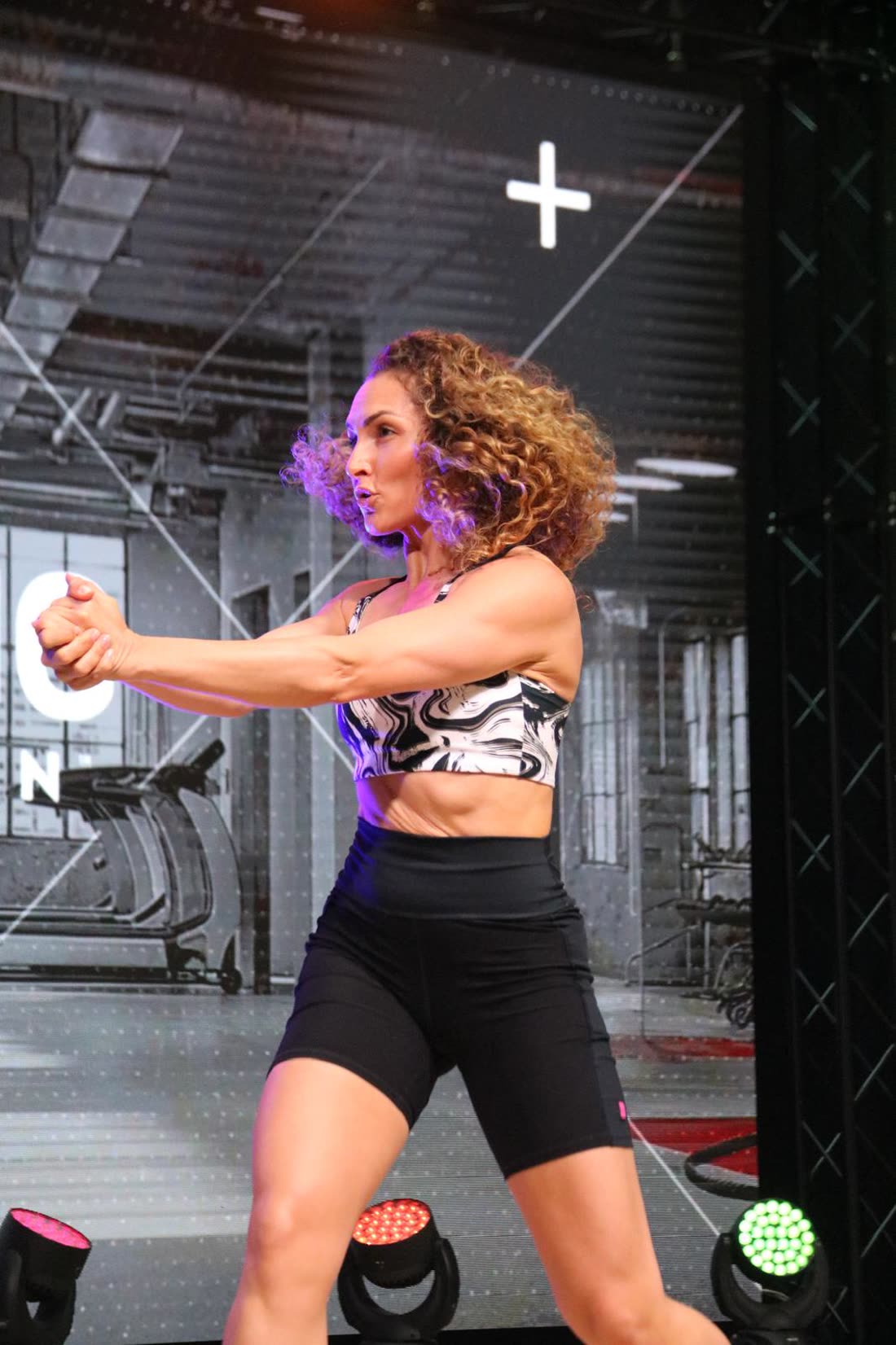 Sabrina mid punch in a high-intensity STRONG Nation session